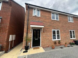 Beautifully presented three-bedroom family home with driveway parking and enclosed garden.